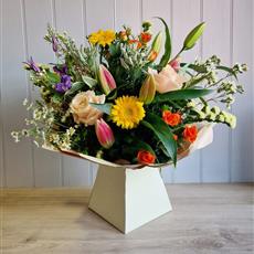 Cheerful Gerbera Hand Tied with Rose Wine